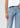 Light blue jeans worn by a person on a white background