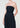 Black strapless jumpsuit worn by a model on a plain background