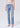 Person wearing light blue jeans on a white background