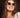 Woman wearing sunglasses with a blurred background