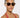 Woman wearing sunglasses and a red halter top against a white background