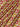 Patterned fabric with red and gold designs on a beige background