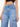 Blue jeans worn by a person on a white background