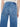 Blue jeans worn by a person on a white background