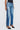 Person wearing blue jeans on a white background