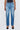 Blue jeans worn by a person on a white background