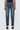 Person wearing blue jeans on a white background