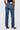 Person wearing blue jeans on a white background