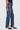 Person wearing blue jeans on a white background