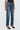 Person wearing blue jeans on a white background