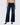 Dark blue jeans with studded details on a white background