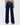 Dark blue jeans worn by a person on a white background