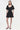 Black dress worn by a model on a white background