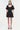Black dress worn by a model on a white background