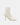 White ankle boot with a high heel on a light gray background