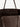 Brown textured tote bag with leather handles on a light gray background